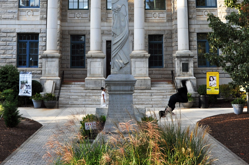 Crop of courthouse pic, guy is doing backflip off statue.jpg